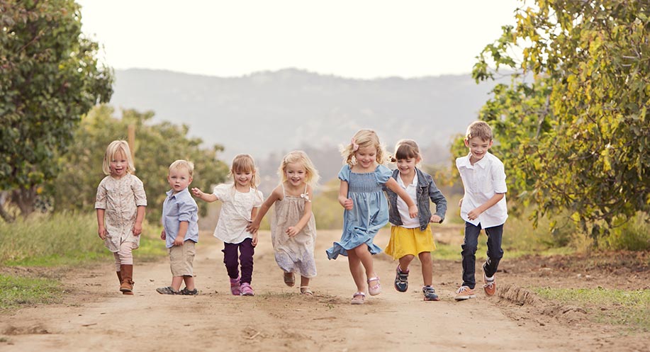 Children running on farm road